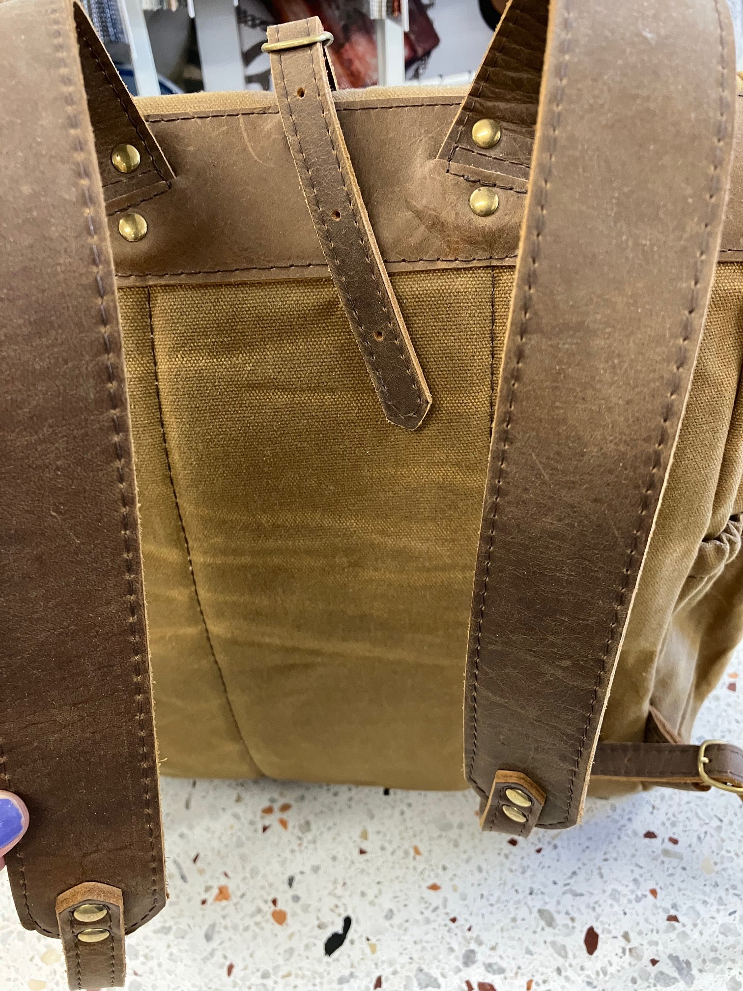 Roll top leather and waxed coton backpack DE LORIMIER model