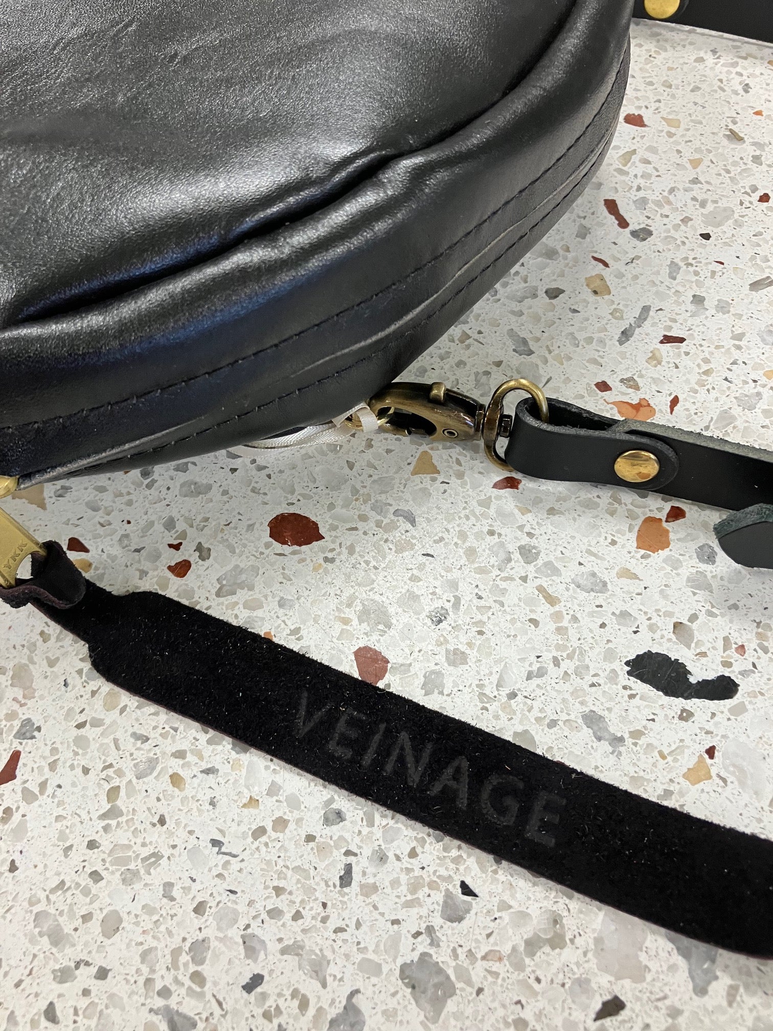 SAMPLE Leather shoulder bag with charm MERINGUE model