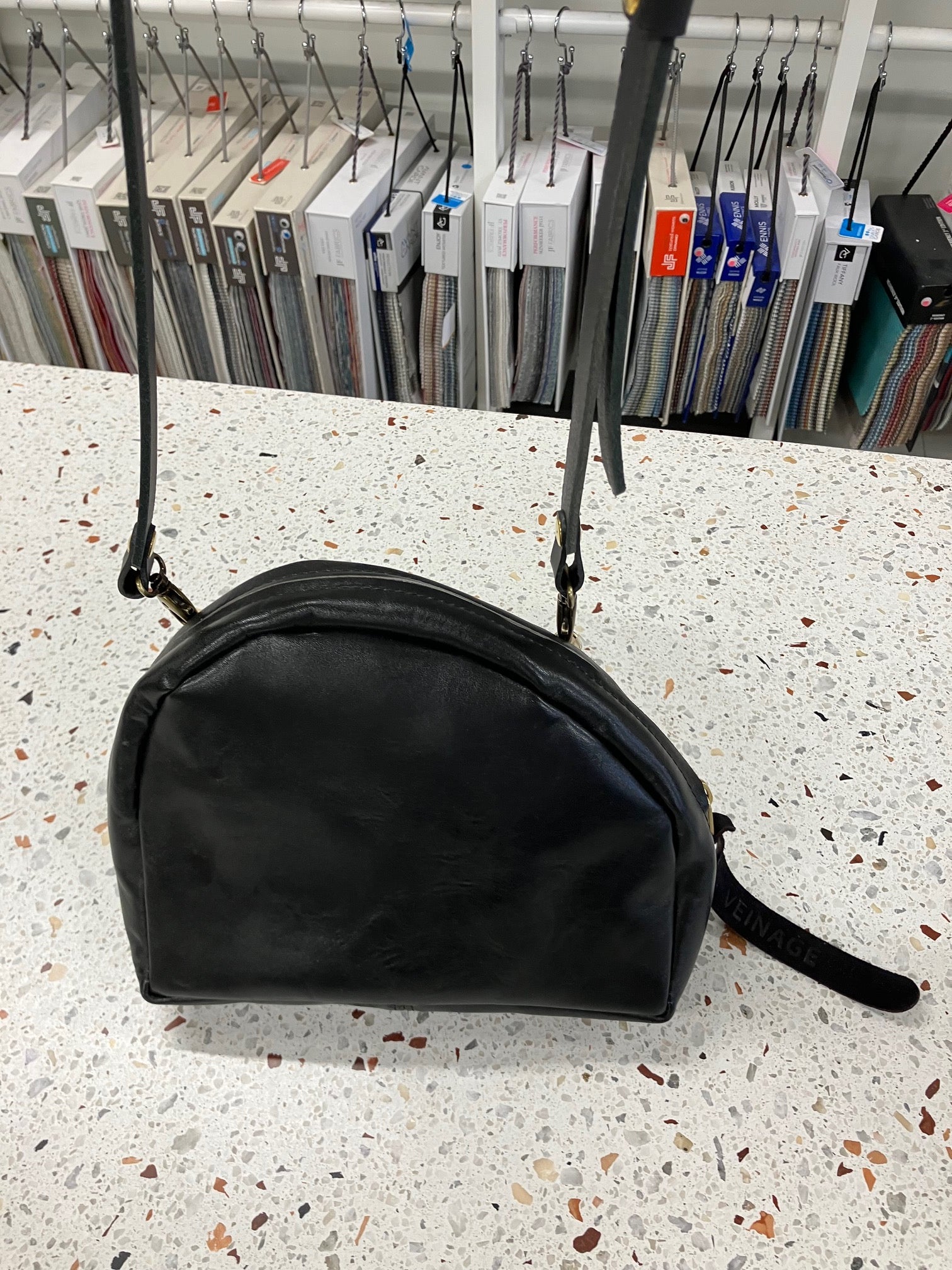 SAMPLE Leather shoulder bag with charm MERINGUE model