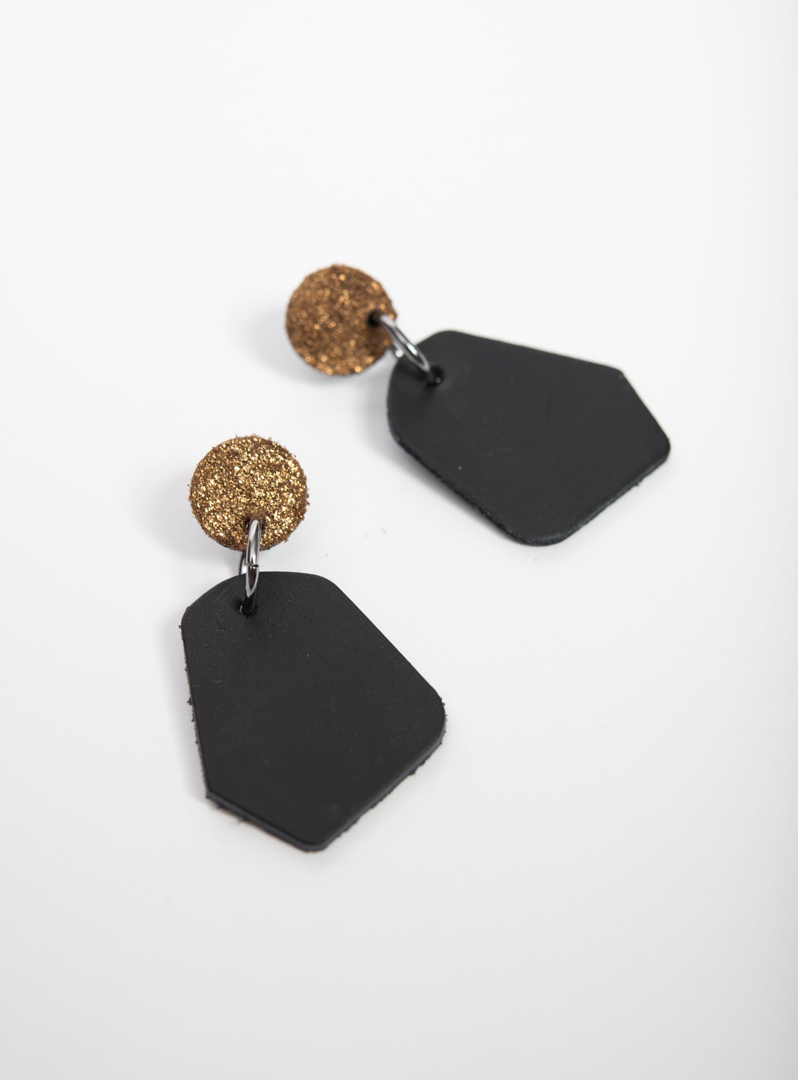 Large geometrical leather earrings DÉLIMA model, Veinage handmade in Montreal, Canada