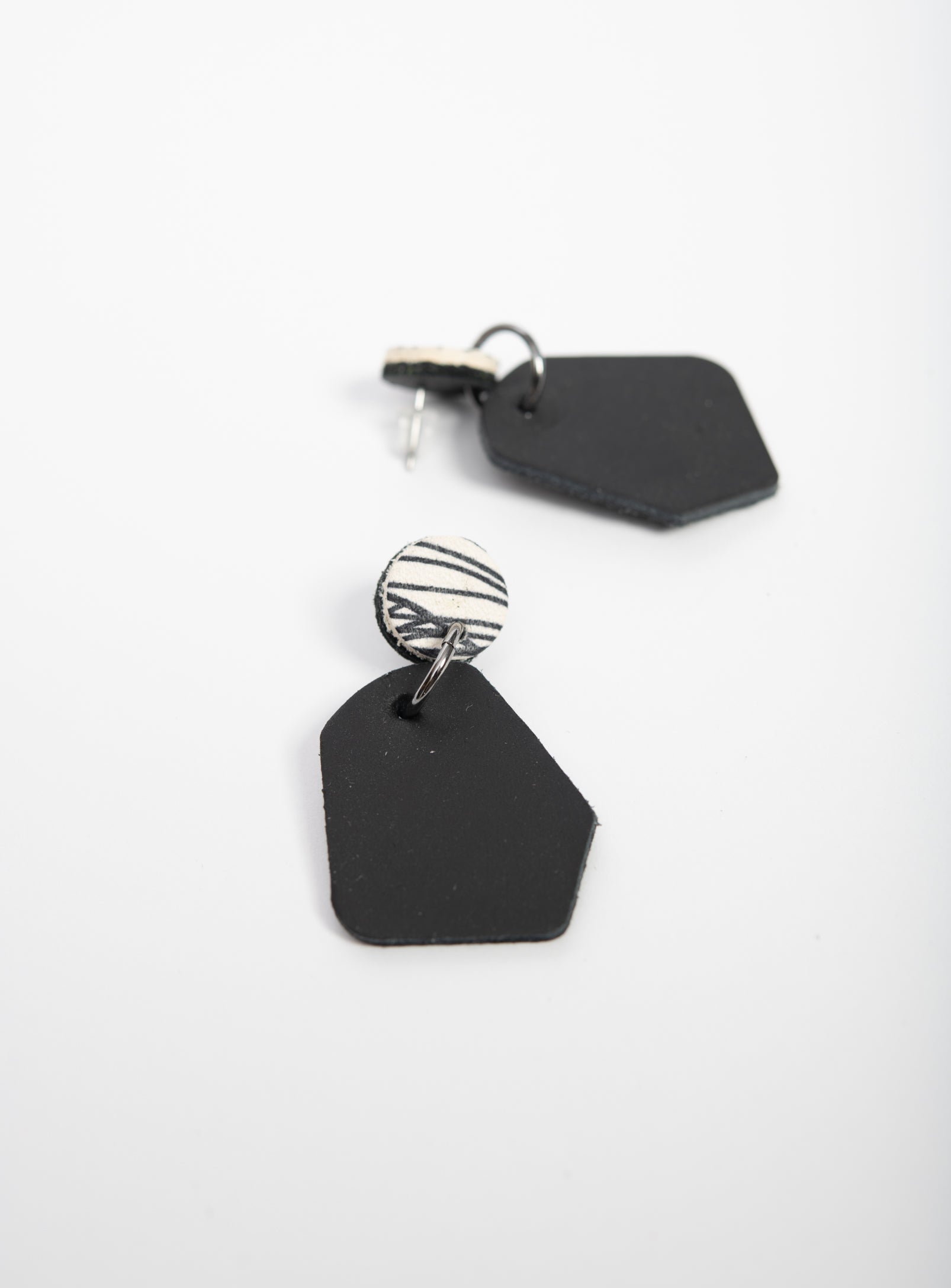 Large geometrical leather earrings DÉLIMA model, Veinage handmade in Montreal, Canada