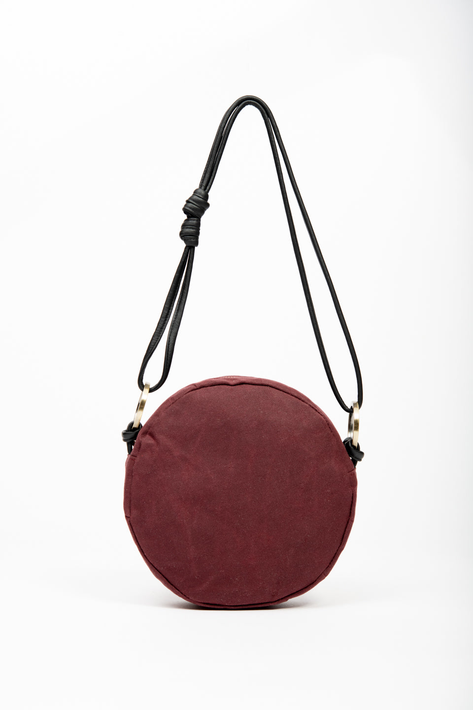 Round shoulder bag model ROTONDO of the collection Variable Geometry by VEINAGE, handmade in Montreal Canada