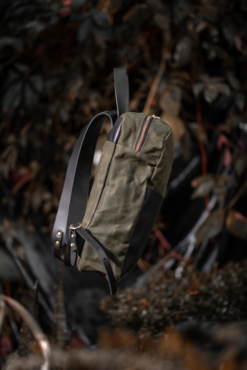 Veinage Gilford black leather and army green waxed canvas backpack, handmade in Montreal Canada